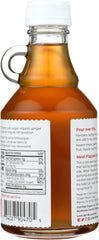 Pour-closeup of The Ginger People organic ginger syrup showing rich color and aroma