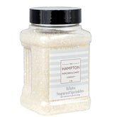 The Hampton Candy Co white sanding sugar sprinkles in a jar for cake decorating.