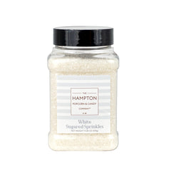 The Hampton Candy Co white sanding sugar sprinkles on ice cream for playful toppings.