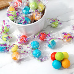 The Hampton Cry Baby Extra Sour Gum Balls open bag on table shows colorful gumballs for celebrations