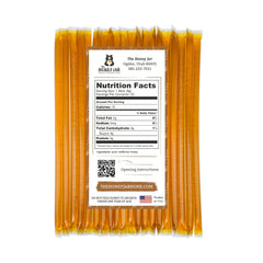 The Honey Jar Wildflower Honey Sticks in a cup of tea for natural flavor.