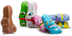 Easter bunny with neck ribbon decoration enhances party favors.
