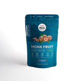 The Mix Superfoods Monk Fruit Pure bottle pour shows zero-calorie sweetness for beverages.