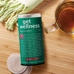 Be Well Red Rooibos tea packaging on shelf emphasizes a caffeine-free wellness option.
