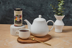 Metabolic Frolic tea bags close-up reveal fragrant blend ideal for afternoon pick-me-ups.