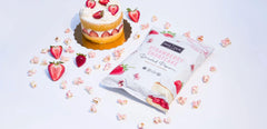The Safe + Fair Strawberry Shortcake Drizzled Kettle Corn being poured—easy snacking on the go.