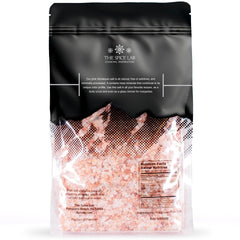 The Spice Lab Pink Himalayan Salt grinder refill with coarse grains for precise flavoring.
