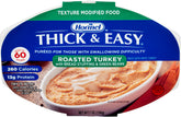 Thick & Easy Purees turkey with stuffing and green beans in a bowl for easy swallowing.
