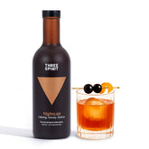 Three Spirit Nightcap bottle on a bar, ideal for a sophisticated non alcoholic evening