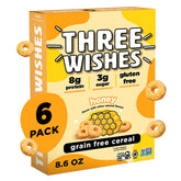 Three Wishes honey-flavored cereal pieces in a bowl with milk, protein-rich breakfast option.