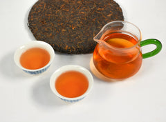 Tian Hu Shan pressed puerh cake detail indicates compact form ideal for aging.