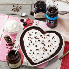 Tillen Farms Bourbon Bada Bing cherries on a cheese board for elegant pairings.