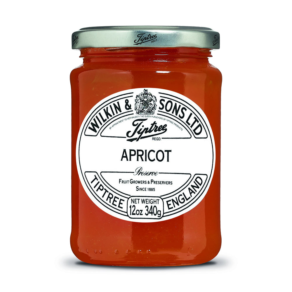 Tiptree Apricot Preserve jar on kitchen counter with chunky fruit, great on toast.