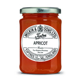 Tiptree Apricot Preserve jar on kitchen counter with chunky fruit, great on toast.