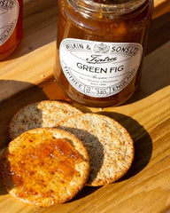 Tiptree Green Fig Preserve with goat cheese pairing, versatile gourmet option.