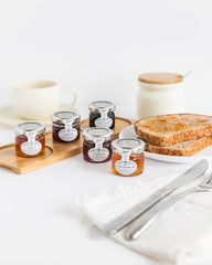 Tiptree Strawberry Preserve Minis case of 72 jars on shelf, ideal for gifting