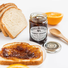 Tiptree Tawny Marmalade beside cheese, suggesting savory-sweet pairing ideas.