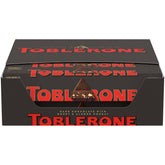 Toblerone dark chocolate bars with honey and almond nougat packaging, ideal for gifting.