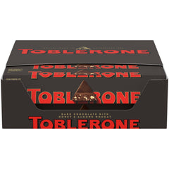 Toblerone dark chocolate bars with honey and almond nougat packaging, ideal for gifting.