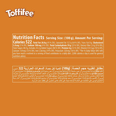 Toffifee creamy caramel dome with nougat center and hazelnut pieces.