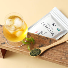 Sunlit TOMOSAN Sencha leaves signaling freshness.