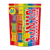 Tony’s Chocolonely milk chocolate coins on a plate, ideal for sharing.