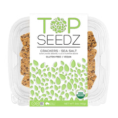 Top Seedz seed crackers on a picnic board with cheese and fruit