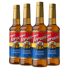 Torani Classic Caramel Syrup bottle pours for rich coffee flavor.