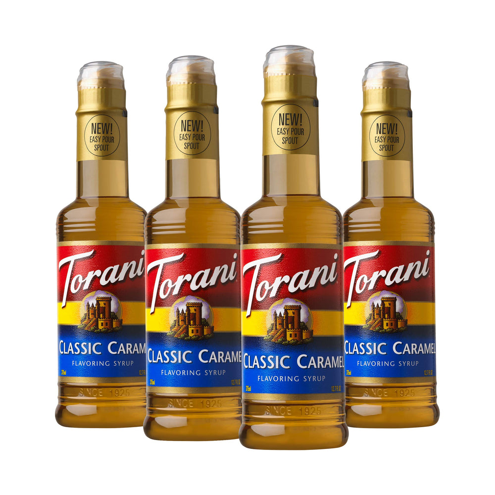 Torani Classic Caramel Syrup bottle on a counter enhances coffee flavor.