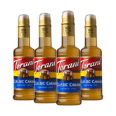 Torani Classic Caramel Syrup bottle on a counter enhances coffee flavor.
