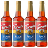 Torani Peach Syrup bottle with peaches for peach-flavored drinks.