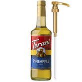 Torani Pineapple Syrup bottle with pump for easy, mess-free flavoring in drinks.
