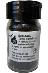 Close-up of ground fermented black garlic texture by Trader Joe's for cooking depth.