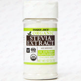 Trader Joe's Organic Stevia Extract bottle on counter, calorie-free sweetness for drinks.