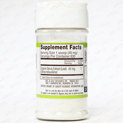 Trader Joe's Organic Stevia Extract dropper dispensing sweetness in coffee.