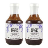 Trader Joe's Soyaki sauce bottles on counter, versatile glaze for marinades and dipping.