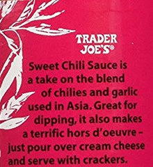 Trader Joe's Sweet Chili Sauce bottle being poured beside appetizers