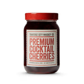 TRAVERSE CITY WHISKEY CO. premium cocktail cherries in a jar, ideal garnish for Old Fashioned cocktails.
