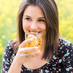 True Lemon Iced Tea being poured into a glass for crisp lemon flavor.