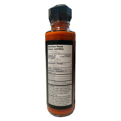 TRUFF hot sauce pouring stream suggests a silky, even heat when added.