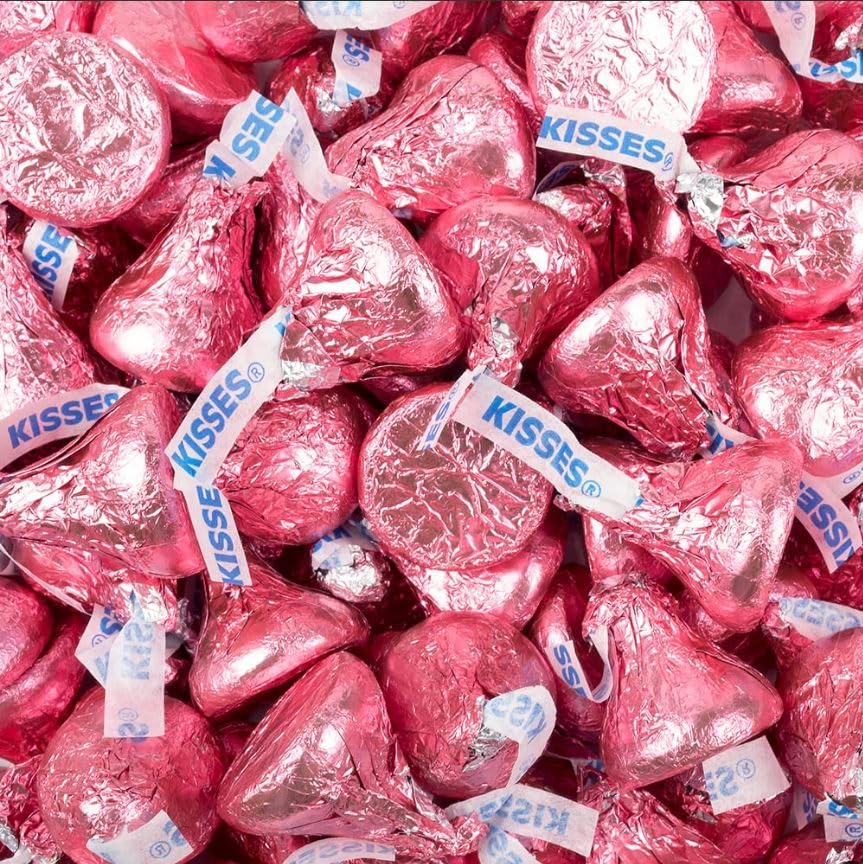 Tundras KISSES pink foil-wrapped milk chocolate candies for bulk party favors.