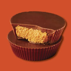 Tundras ReeseMilk rich chocolate coating on bite-sized cups, indulgent texture.
