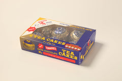 Tunnock's Tea Cakes dark chocolate biscuit base close-up, with crisp texture.