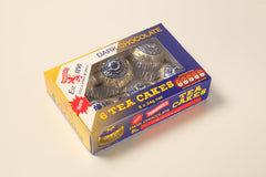 Tunnock's Tea Cakes marshmallow close-up, showcasing fluffy center and glossy coating.