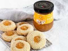 Tuscanini apricot preserves spread on toast, bright color and inviting aroma.