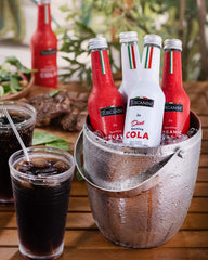 Tuscanini Organic Cola on a dining table setup, ideal for gatherings