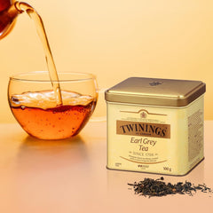 Twinings Earl Grey loose tea leaves steeping in a cup for energizing flavor