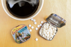 The Unemployed Philosophers Guild Alice's Enchantmints open tin shows sugar-free mints for discreet refreshment.
