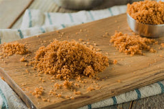 Unpretentious Dark Brown Sugar dusting pancakes adds caramel flavor.