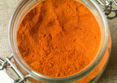 Unpretentious ground cayenne pepper dusting on lime for vibrant flavor